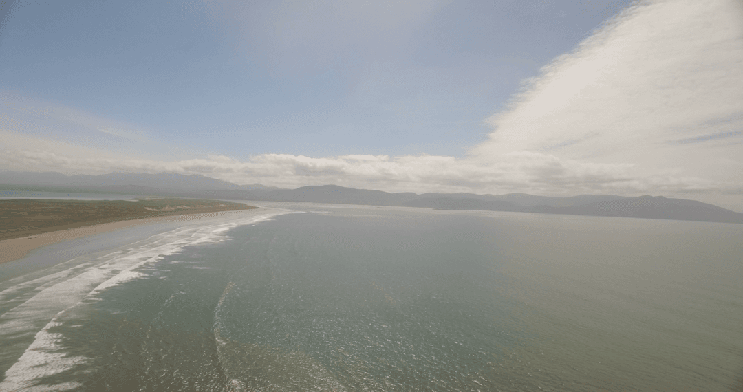Transparent Coastal View Overlooking Calm Emerald Waters
