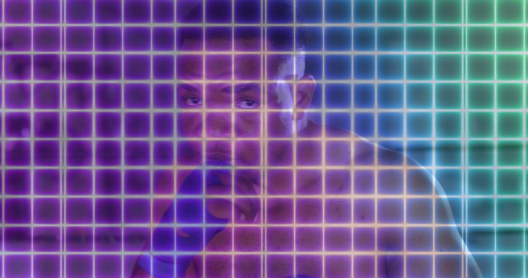 Shirtless Boxer Standing Guard with Blue Hand Wraps in Neon Holographic Grid Studio