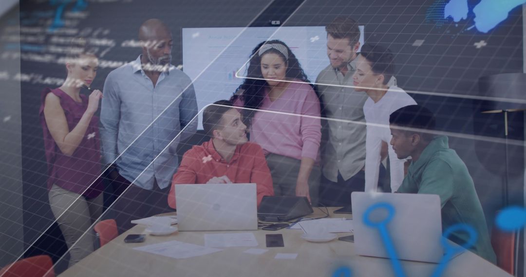 Diverse Team Collaborating on Innovative Ideas with Technology