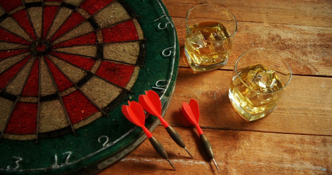 Darts Game with Whiskey Glasses on Wooden Table - Free Images, Stock Photos and Pictures on Pikwizard.com