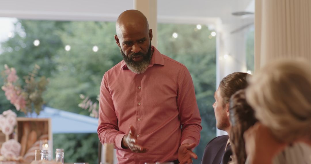 Man Delivering Passionate Speech at Wedding Reception