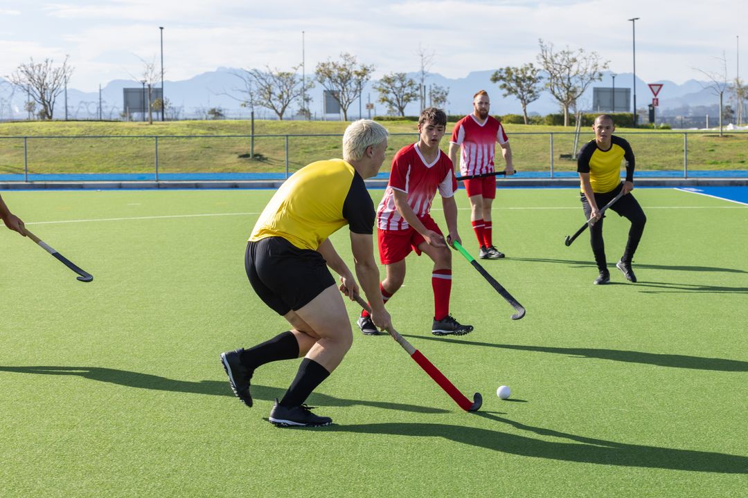 Teamwork in Action: Field Hockey Players Competing Intensely Outdoors