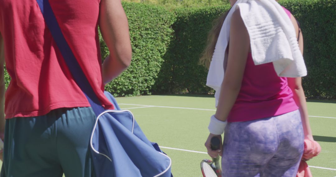 Tennis Players Carrying Equipment Bags on Court - Free Images, Stock Photos and Pictures on Pikwizard.com