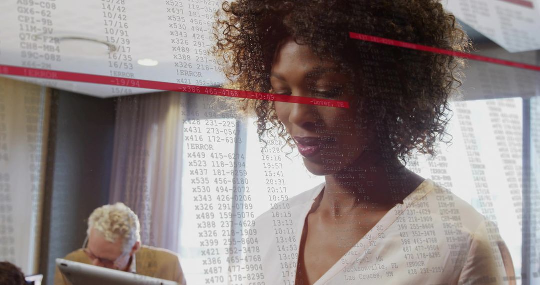 Woman Reviewing Code in Collaborative Office Environment