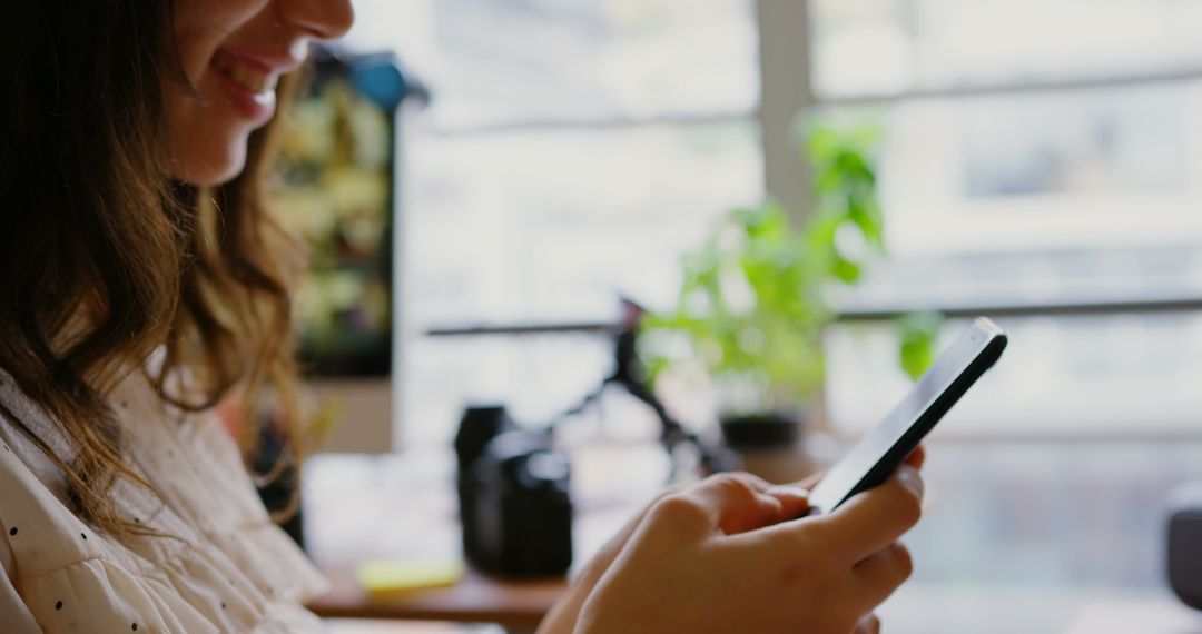 Caucasian Female Graphic Designer Texting in Modern Office