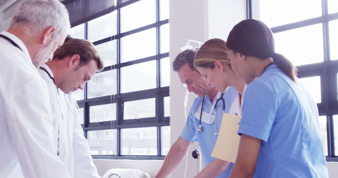 Medical Team Collaborating in Hospital - Free Images, Stock Photos and Pictures on Pikwizard.com