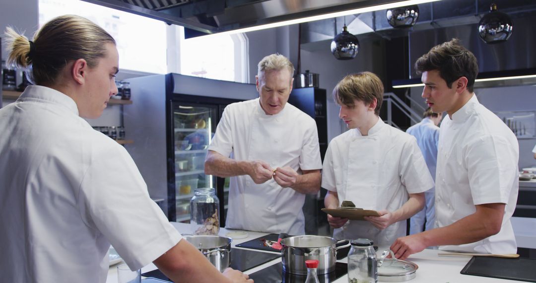 Chef Teaching Young Cooks in Modern Kitchen - Free Images, Stock Photos and Pictures on Pikwizard.com