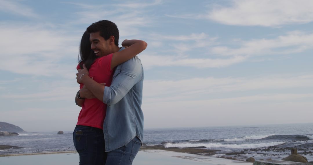 Couple Embracing With Ocean View - Free Images, Stock Photos and Pictures on Pikwizard.com