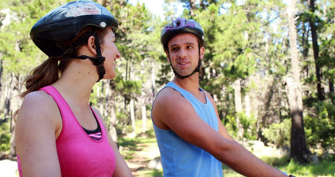 Couple Enjoying Outdoor Mountain Biking Together in Forest - Free Images, Stock Photos and Pictures on Pikwizard.com