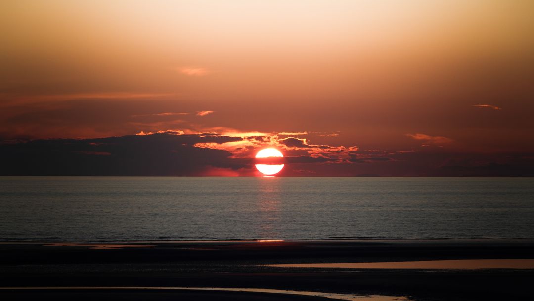 Stunning Ocean Sunset with Fiery Red Sky - Free Images, Stock Photos and Pictures on Pikwizard.com