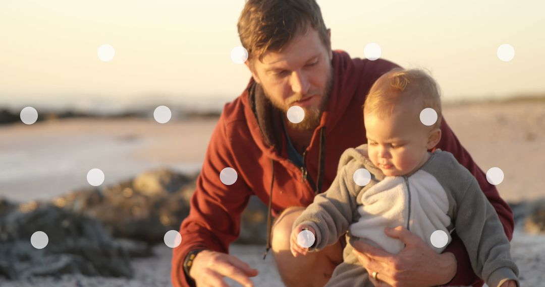 Father Enjoying Outdoor Moment with Toddler in Warm Light