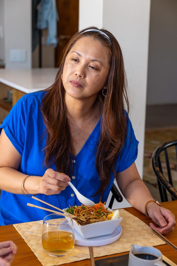 Woman Enjoying Comforting Noodle Meal at Home