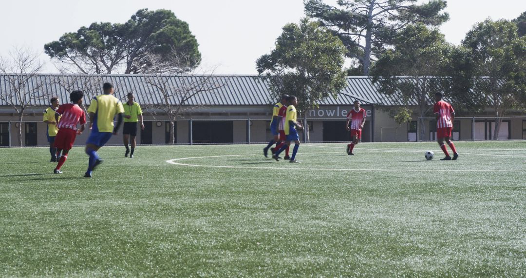 Youth Soccer Players Strategizing on Field During Match Preparation