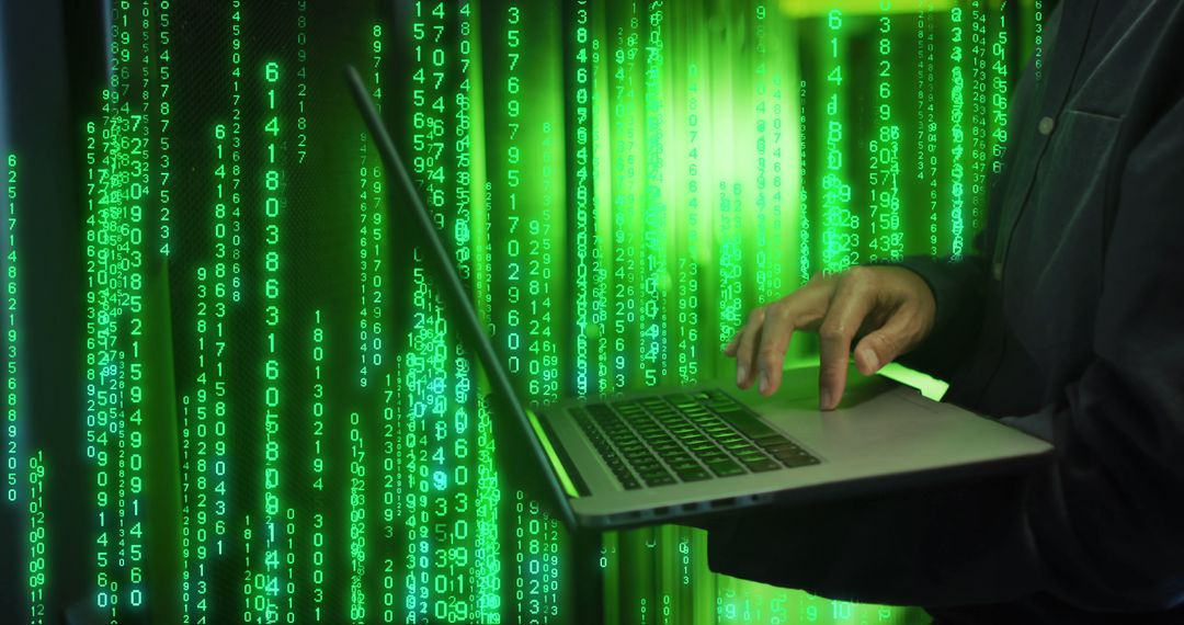 Cybersecurity Expert Using Laptop in Server Room