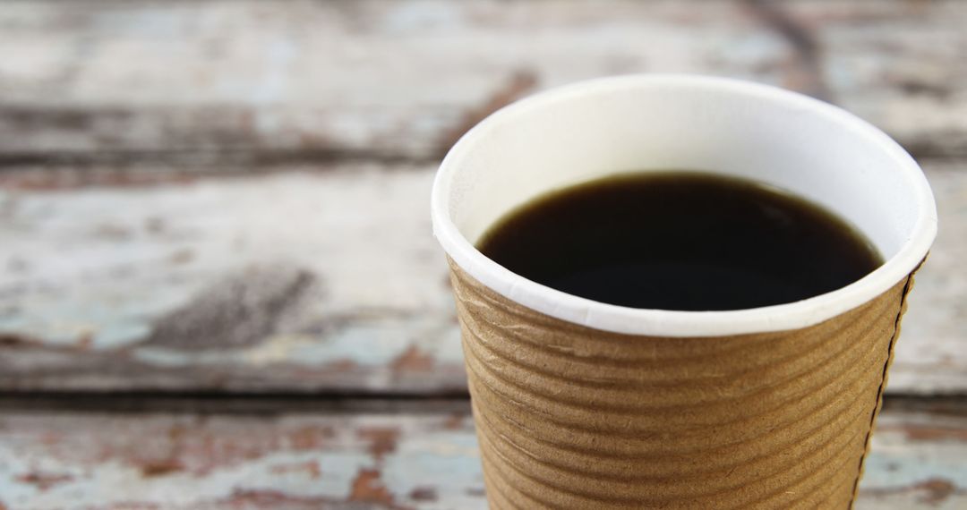 Close-up of Hot Black Coffee in Brown Paper Cup on Rustic Wooden Table - Free Images, Stock Photos and Pictures on Pikwizard.com