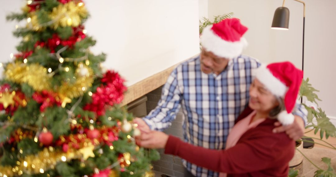 Happy Senior Couple Decorating Christmas Tree Together at Home - Free Images, Stock Photos and Pictures on Pikwizard.com