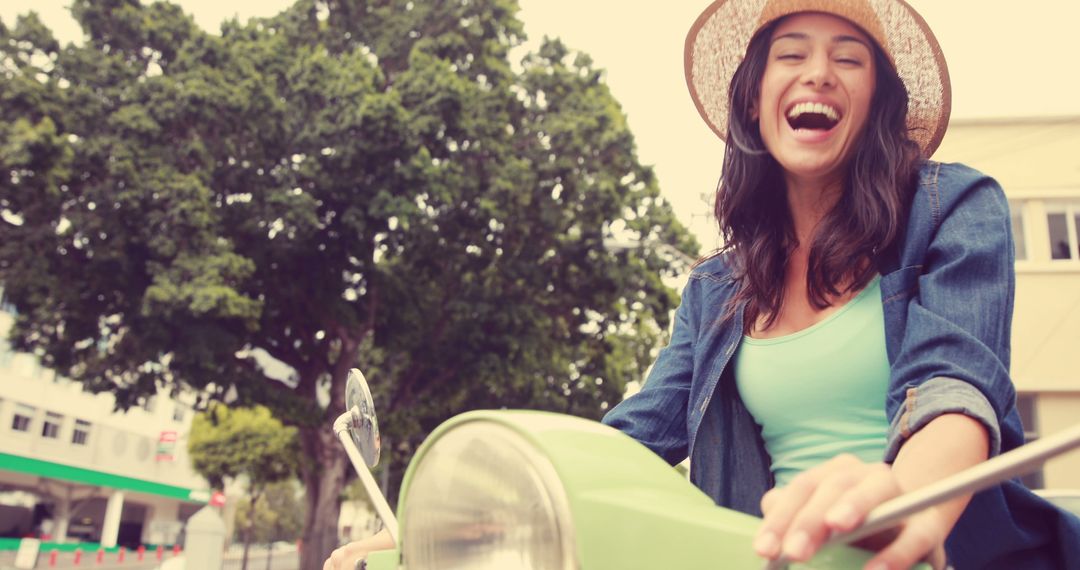 Young Woman Enjoying Ride on Vintage Scooter - Free Images, Stock Photos and Pictures on Pikwizard.com