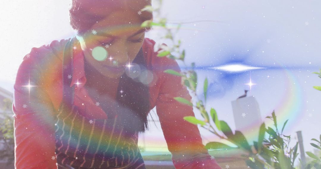 Gardener in Apron Tending Lush Plants with Prism Flare and Rainbow Effect