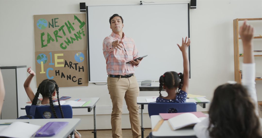 Teacher Engaging Students in Classroom Discussion on Earth Day - Free Images, Stock Photos and Pictures on Pikwizard.com