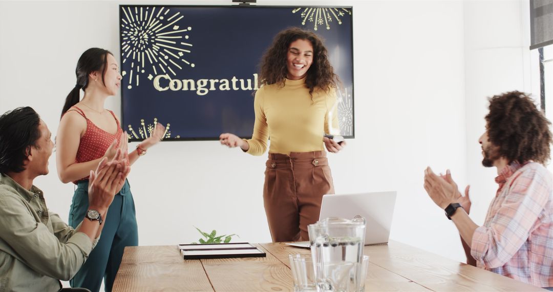 Diverse Team Celebrating Success with Congratulations Display