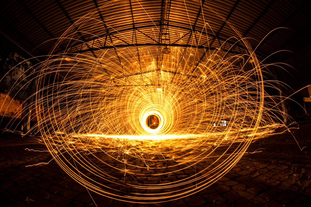 Long Exposure Sparkler Light Painting in Industrial Warehouse - Free Images, Stock Photos and Pictures on Pikwizard.com