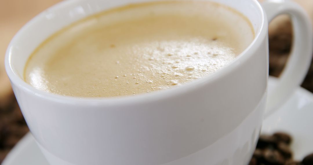 A close-up view of a freshly brewed cup of coffee in a white mug, with copy space - Free Images, Stock Photos and Pictures on Pikwizard.com