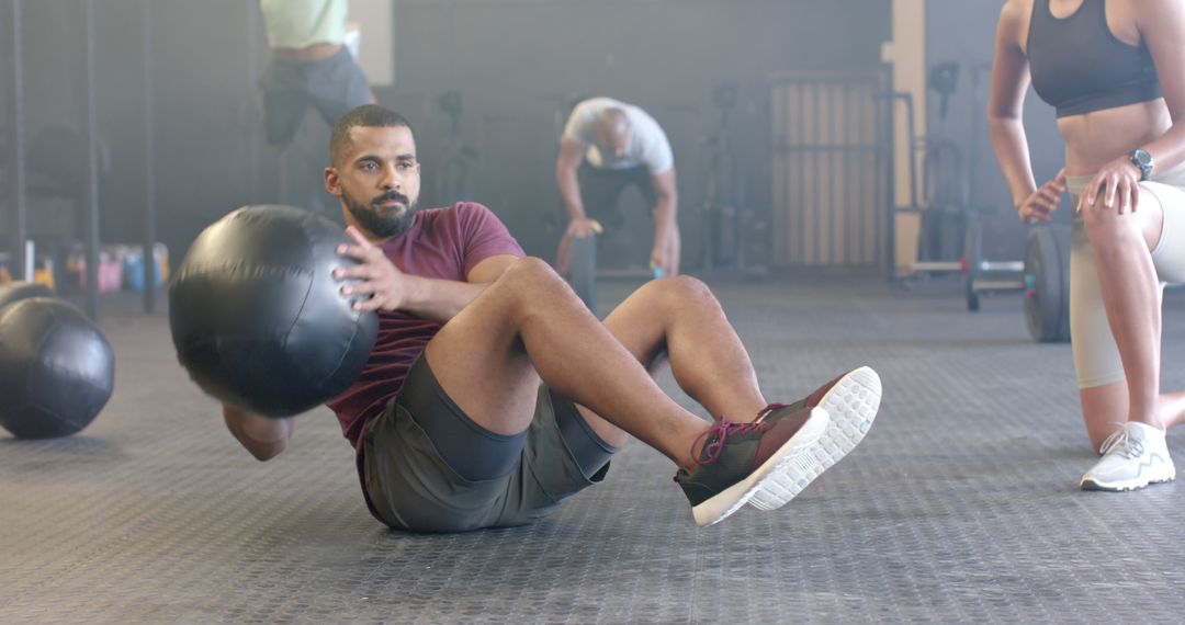 Man Exercising with Medicine Ball at Gym, Focused Fitness Training - Free Images, Stock Photos and Pictures on Pikwizard.com