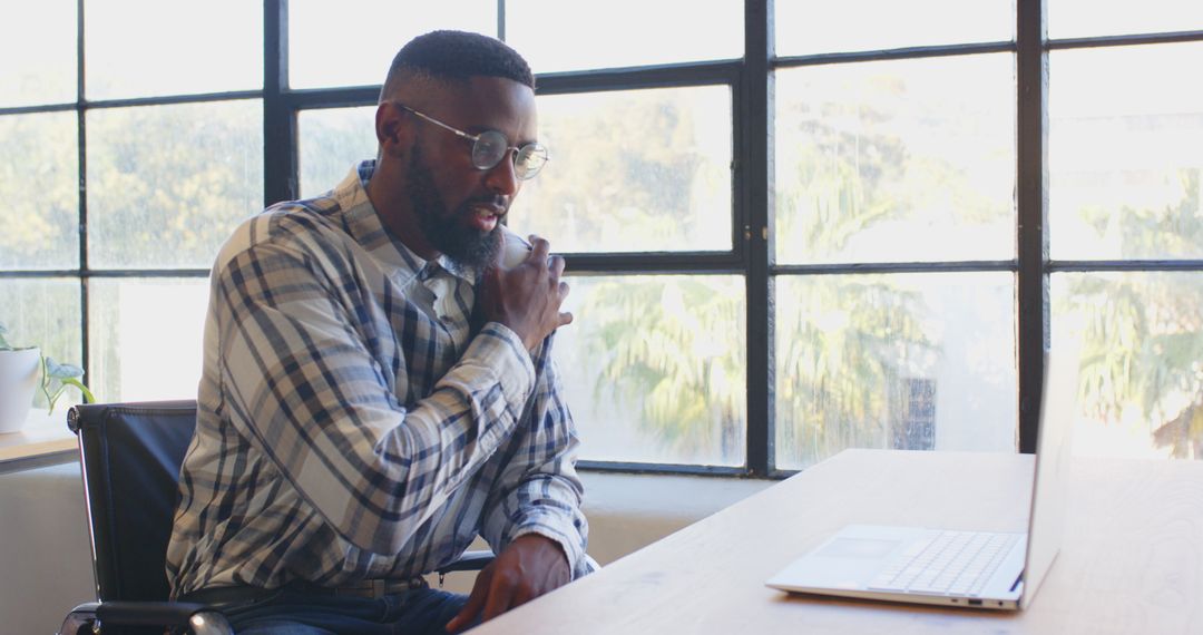 Businessman Discussing Project on Laptop Communicating Remotely