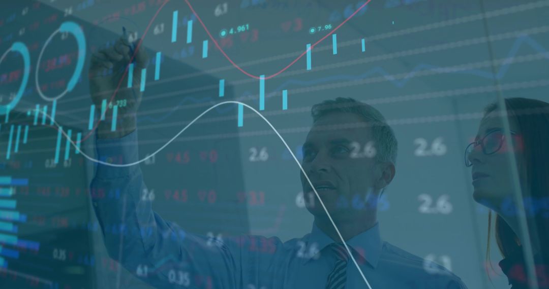 Businessman Analyzing Trends on Digital Graphic Interface