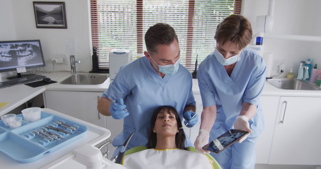 Dentists Explaining Dental Procedure to Patient - Free Images, Stock Photos and Pictures on Pikwizard.com