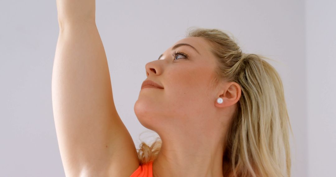 Blonde Woman Reaching Up for Morning Stretch - Free Images, Stock Photos and Pictures on Pikwizard.com