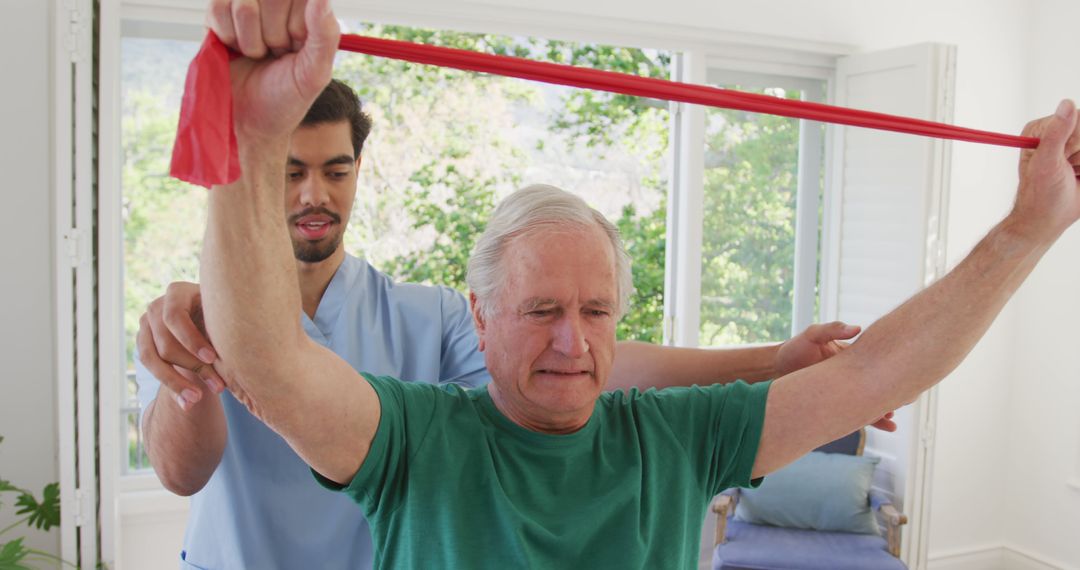 Senior Man Exercising with Physical Therapist at Home for Rehabilitation - Free Images, Stock Photos and Pictures on Pikwizard.com