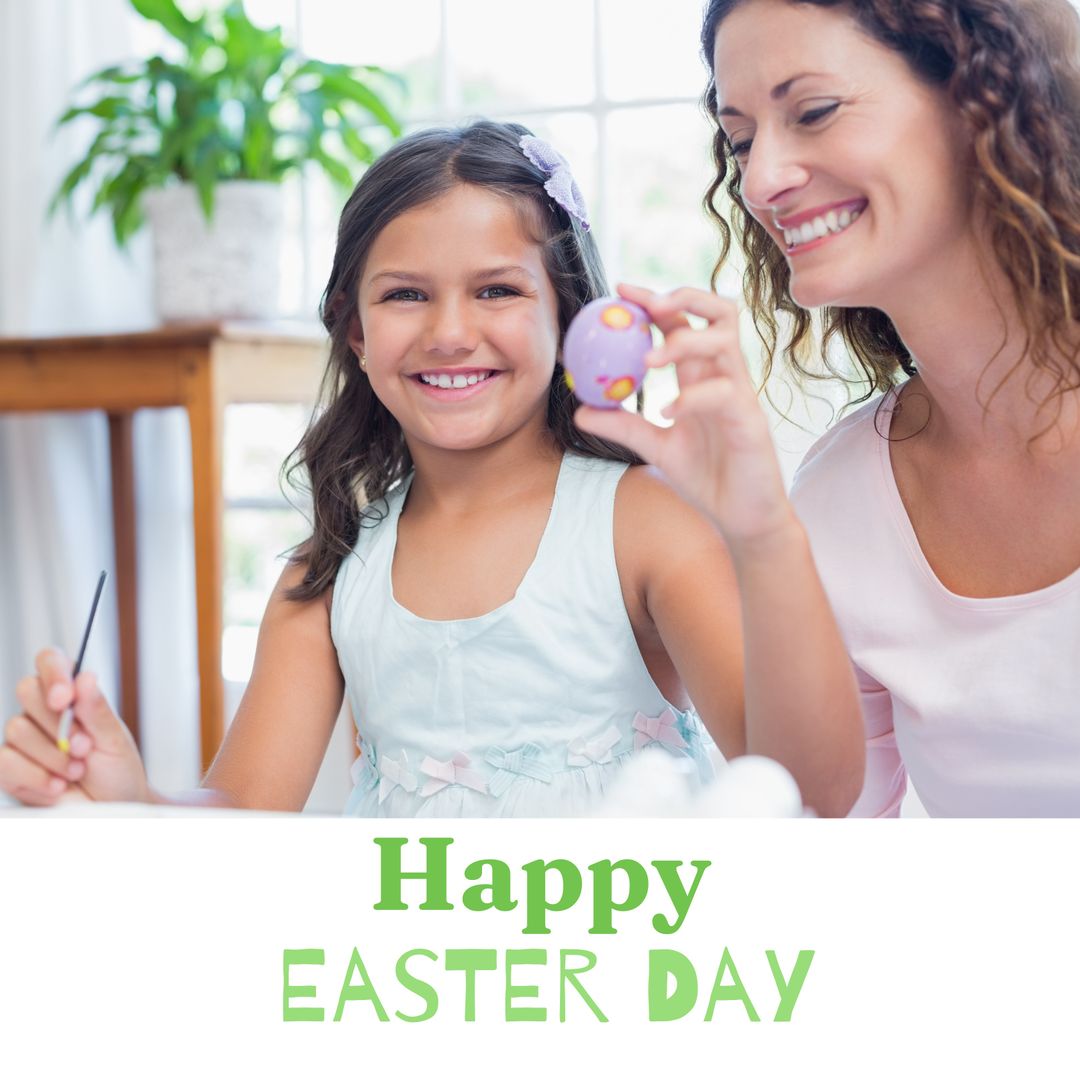 Mother and Daughter Joyfully Painting Easter Eggs