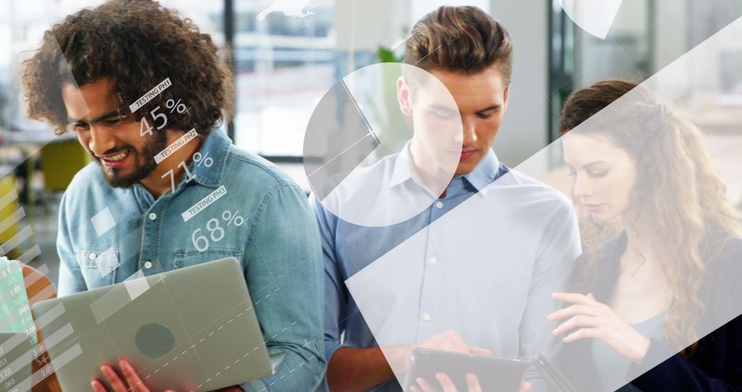 Colleagues Analyzing Data on Devices in Modern Office