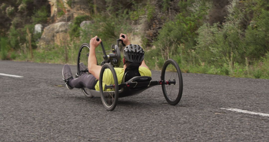 Athlete Racing on Handcycle Outdoors on Scenic Road - Free Images, Stock Photos and Pictures on Pikwizard.com