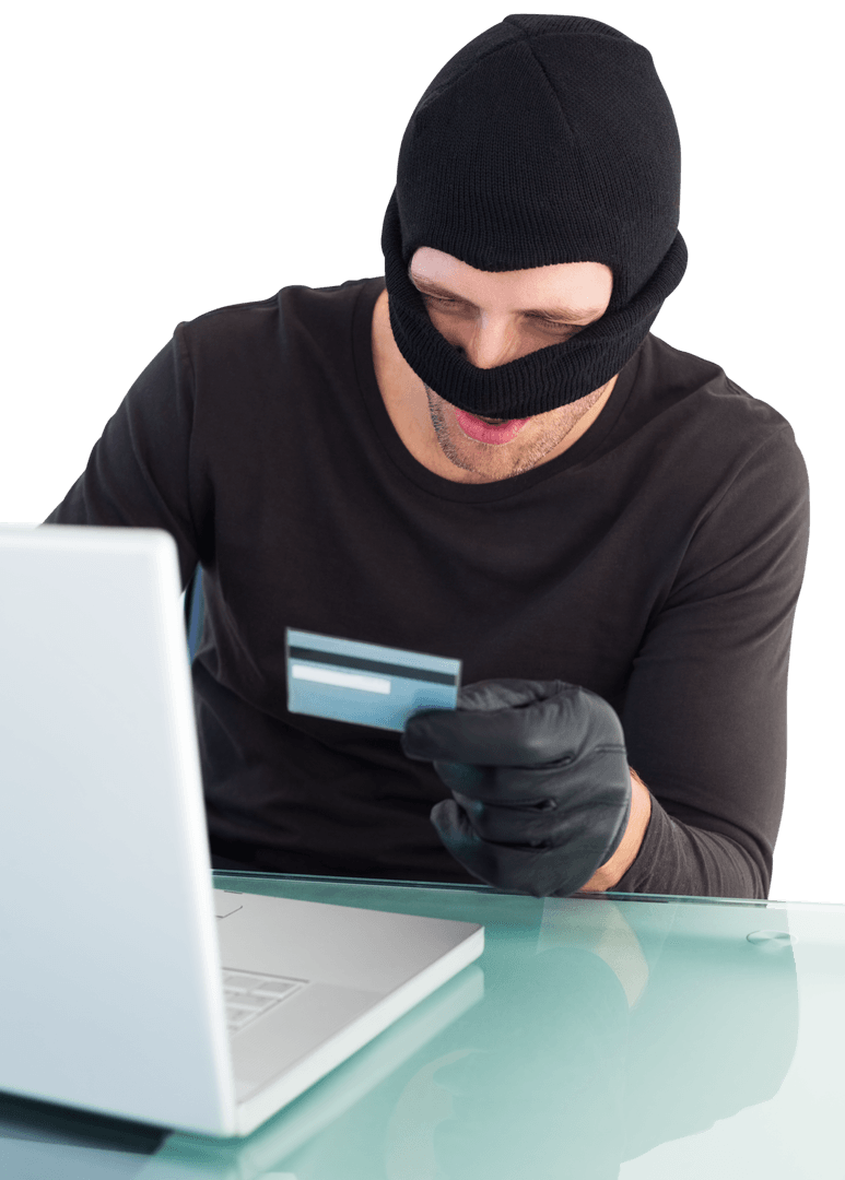 Man in Black Using Laptop and Card for Fraud