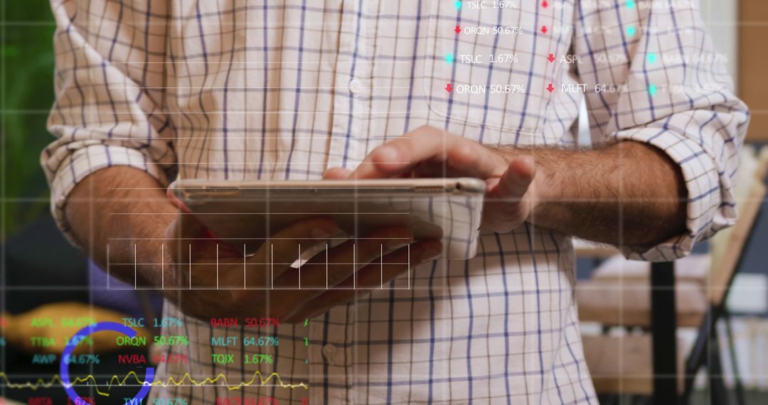 Professional Analyzing Data on Digital Tablet