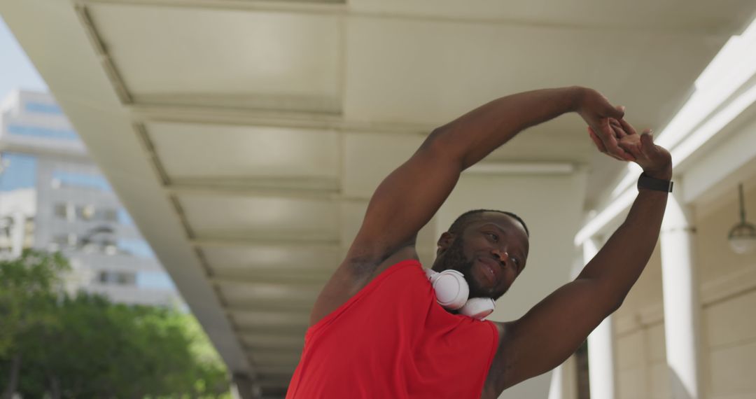 Active African American Man Stretching Outdoors in Urban Area - Free Images, Stock Photos and Pictures on Pikwizard.com