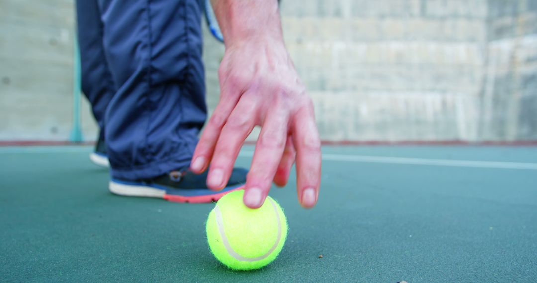 Tennis Player's Hand Reaching for Ball on Court Surface - Free Images, Stock Photos and Pictures on Pikwizard.com