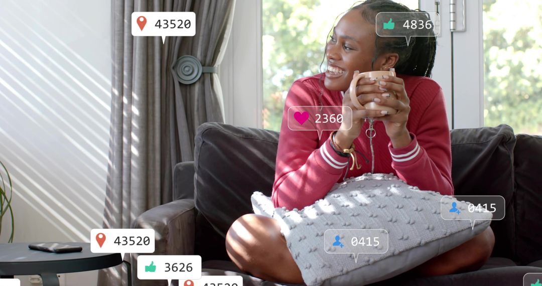 Woman Relaxing on Sofa with Mug and Smartphone at Home