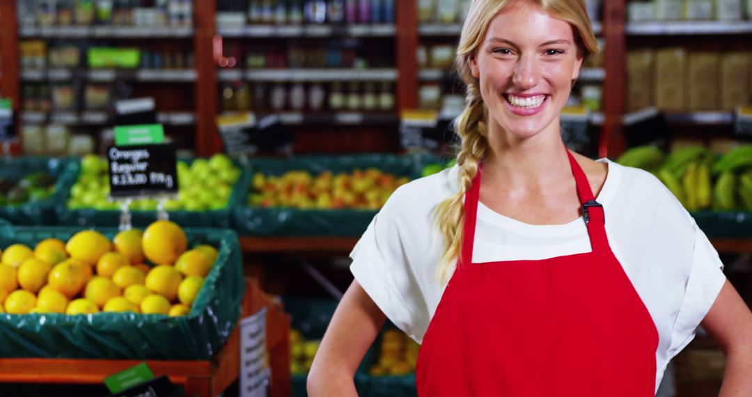 Smiling Female Worker in Supermarket with Fresh Produce - Free Images, Stock Photos and Pictures on Pikwizard.com