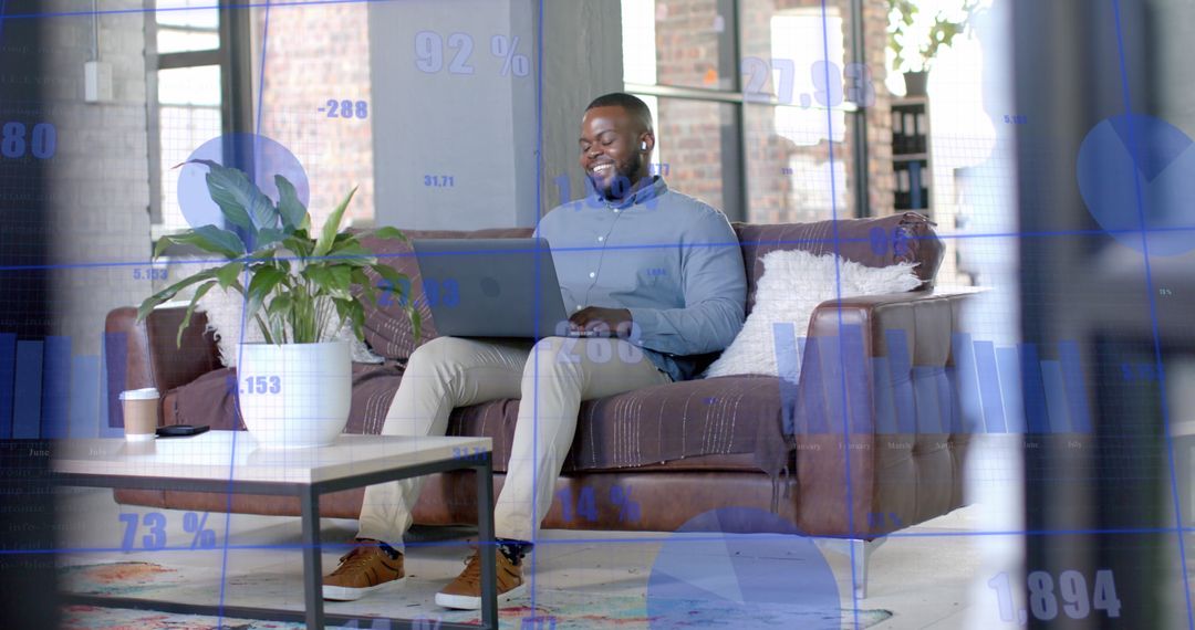 Happy Businessman Engaging in Remote Work With Digital Data Overlay