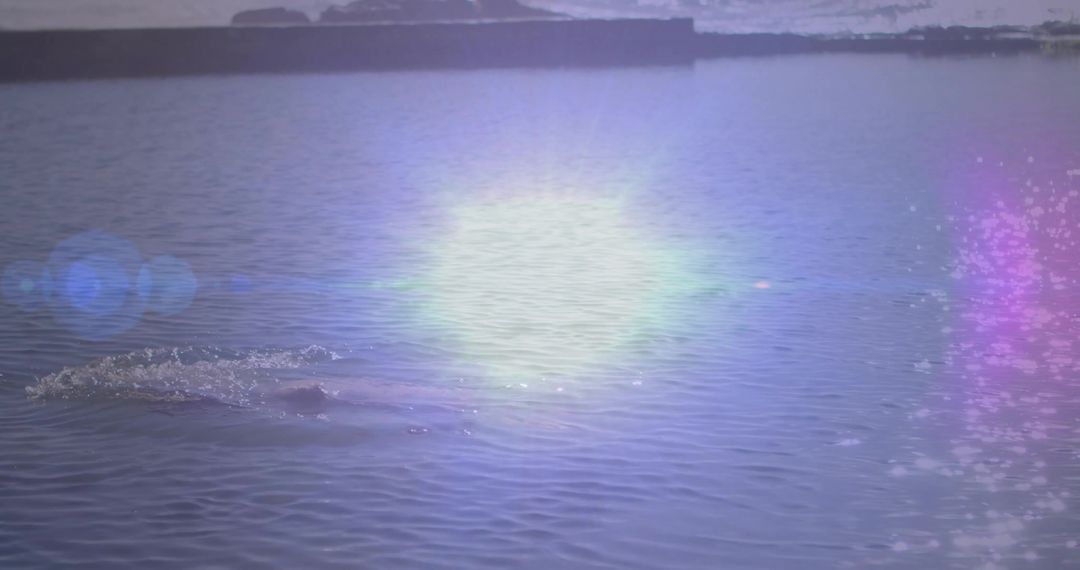 Tranquil Reservoir View with Illuminating Lens Flare
