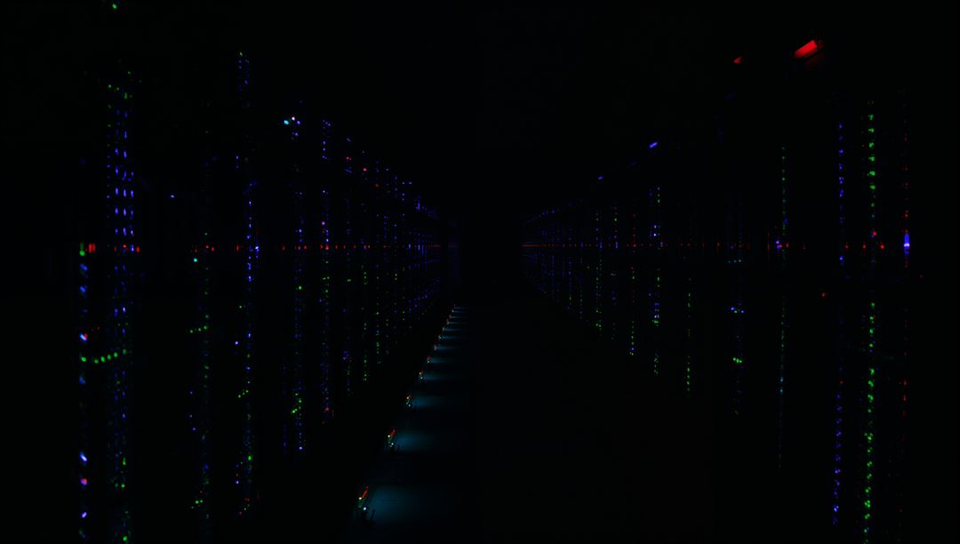 Glowing Server Rack Aisle Illuminating Dark Data Center Corridor with LED Floor Lights