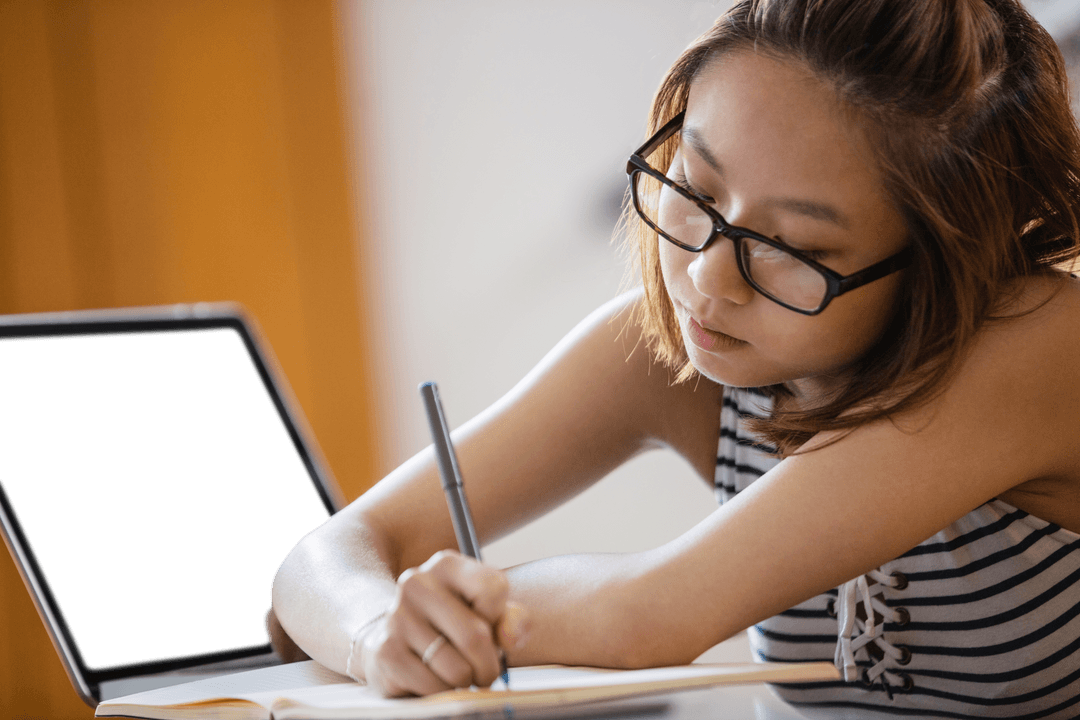 Focused Student Studying with Laptop and Notebook, Transparent Use in Educational Contexts
