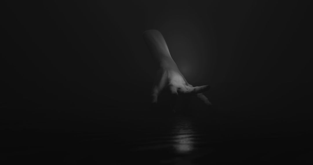Mysterious Hand in Shadowed Darkness Evokes Intrigue