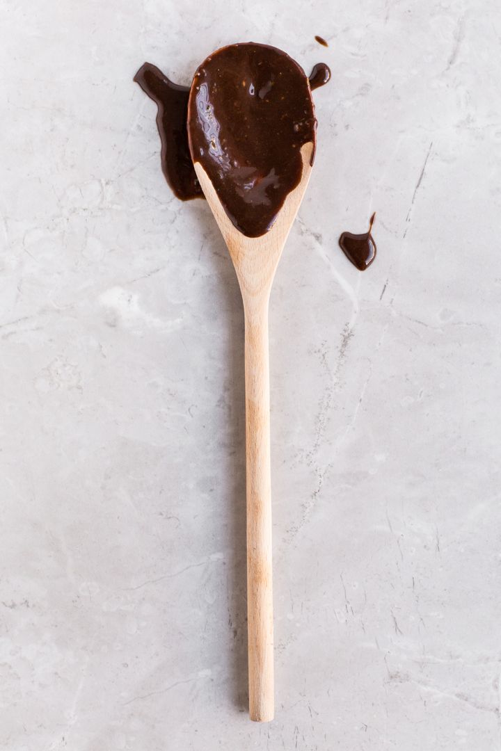 Wooden Spoon with Chocolate Spatters on Marble Surface - Free Images, Stock Photos and Pictures on Pikwizard.com
