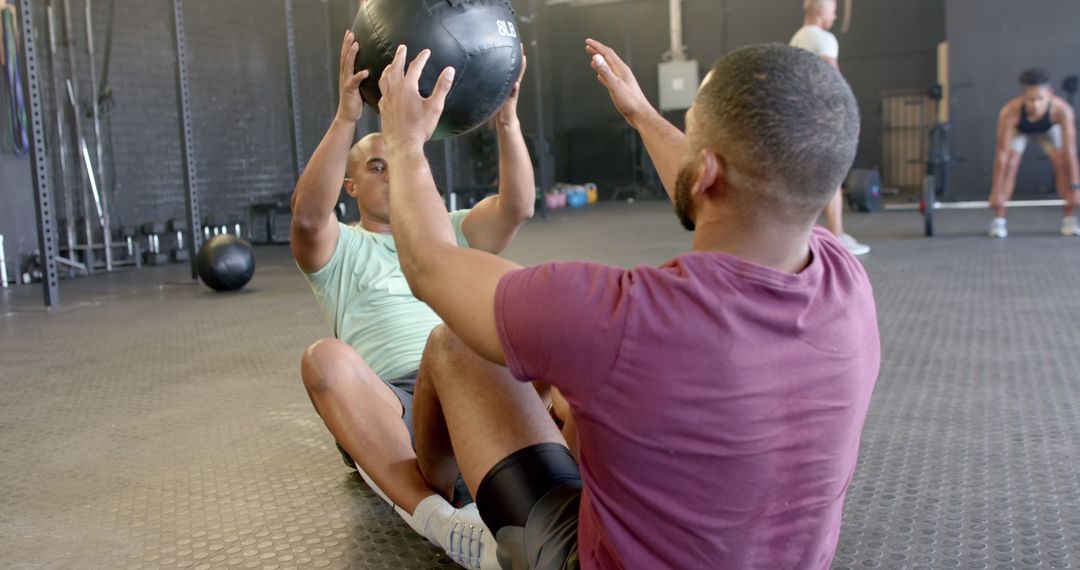 Men Exercising With Medicine Ball in Gym - Free Images, Stock Photos and Pictures on Pikwizard.com