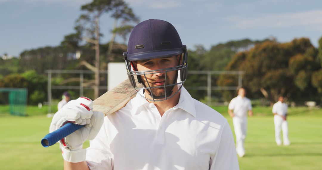 Cricket Player with Bat on Field During Game