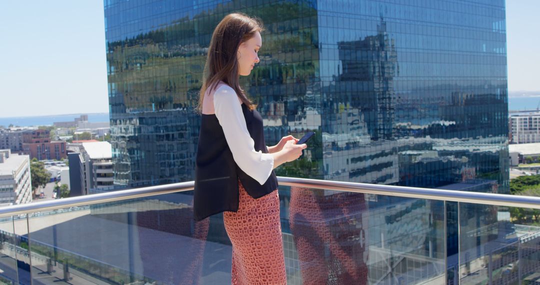 Businesswoman Using Smartphone Outdoors with City View - Free Images, Stock Photos and Pictures on Pikwizard.com